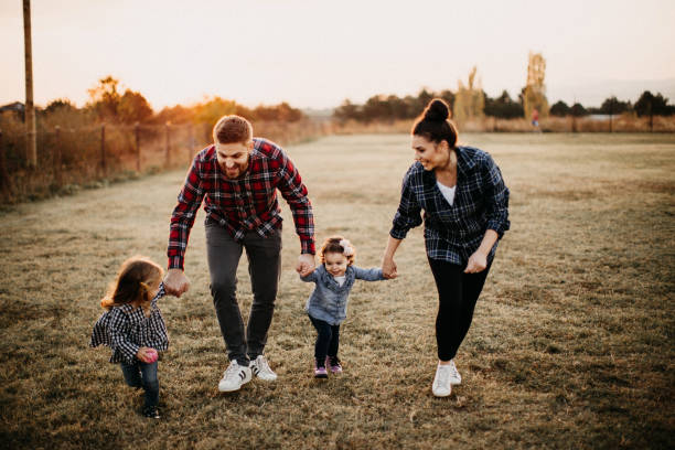 image of a family walking in the park